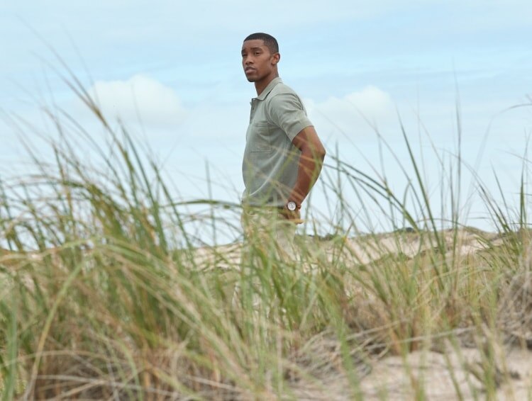 Image of a man walking on a beach