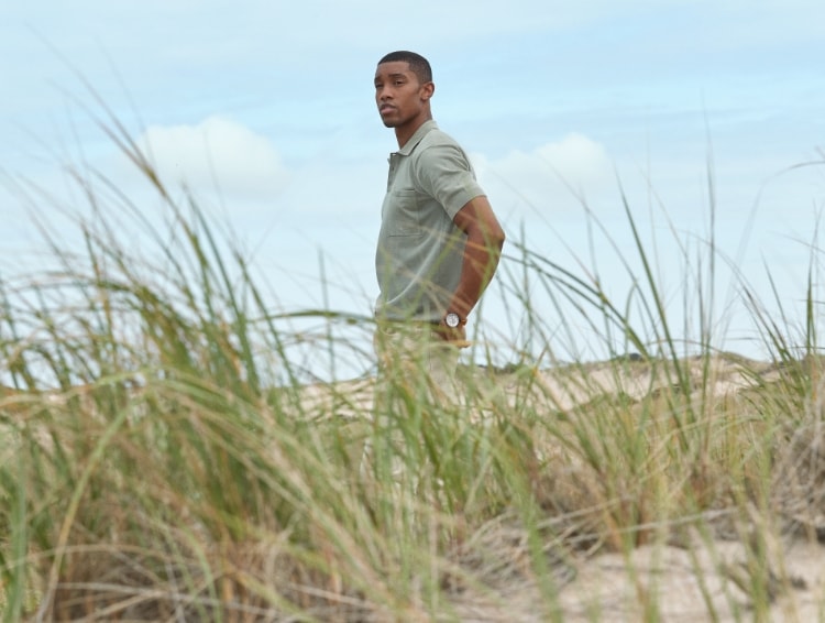Image of a man walking on a beach