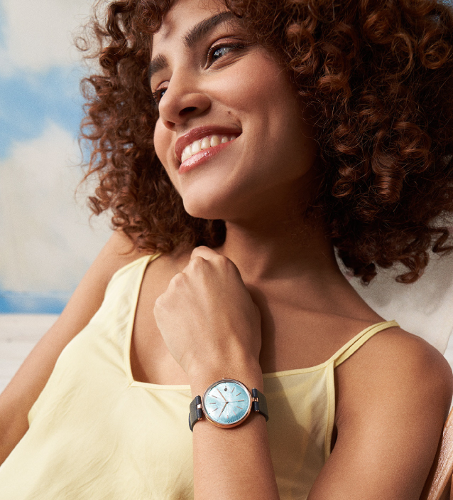 a woman wearing a solar watch