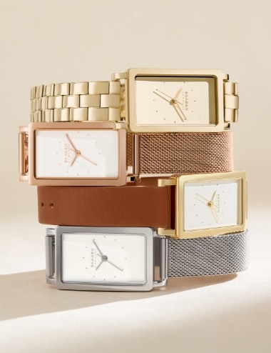 Image of a golden watch with a rectangular case