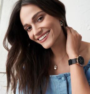 Rose gold-tone case with a black dial and black leather strap.