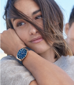 Image of a women wearing a solar-powered Skagen watch