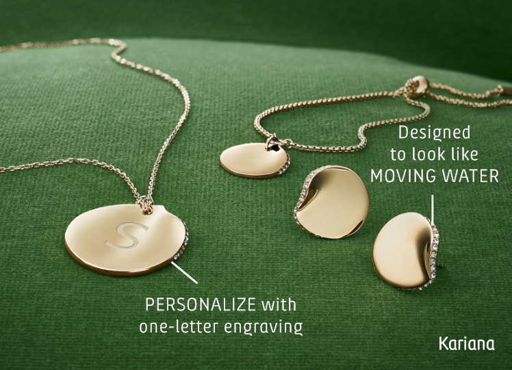 A suite of jewelry on a green sofa.