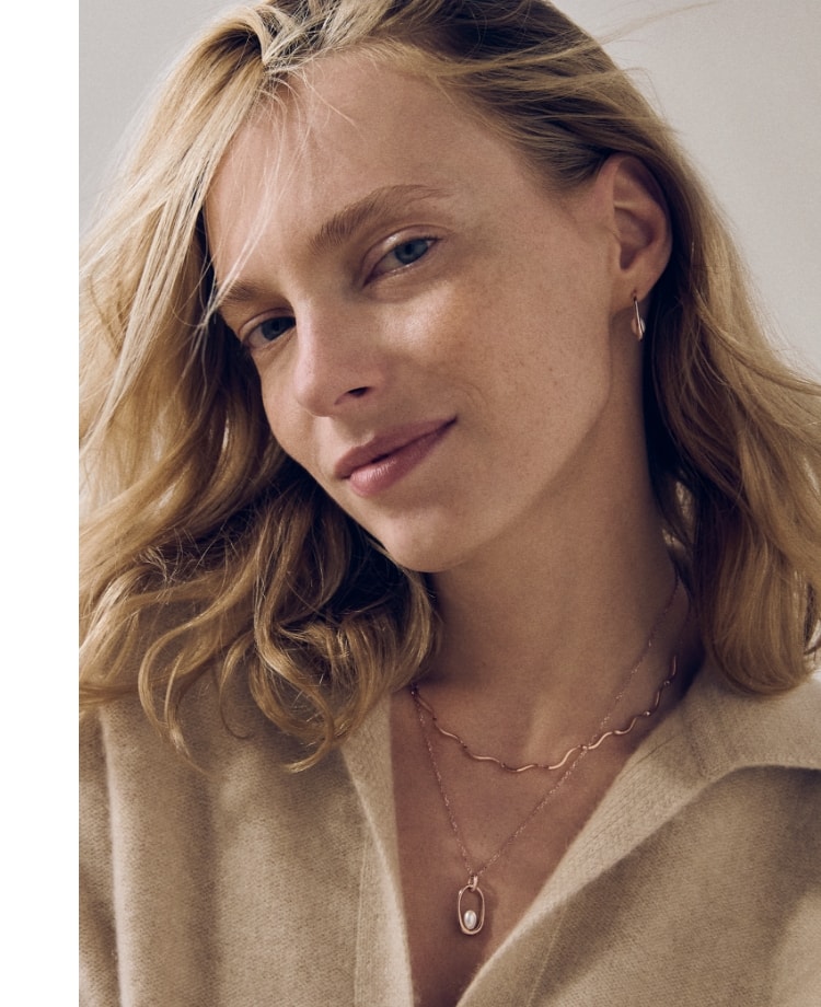 Image of model wearing earrings and necklace from the Sea Lantern jewellery collection