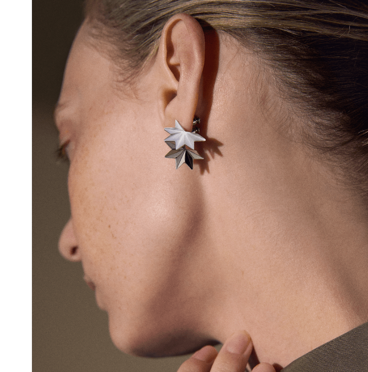 Female model wearing Skagen earrings.