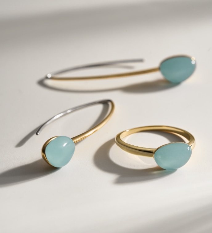 Image of the rose gold-tone jewellery with mint green features.