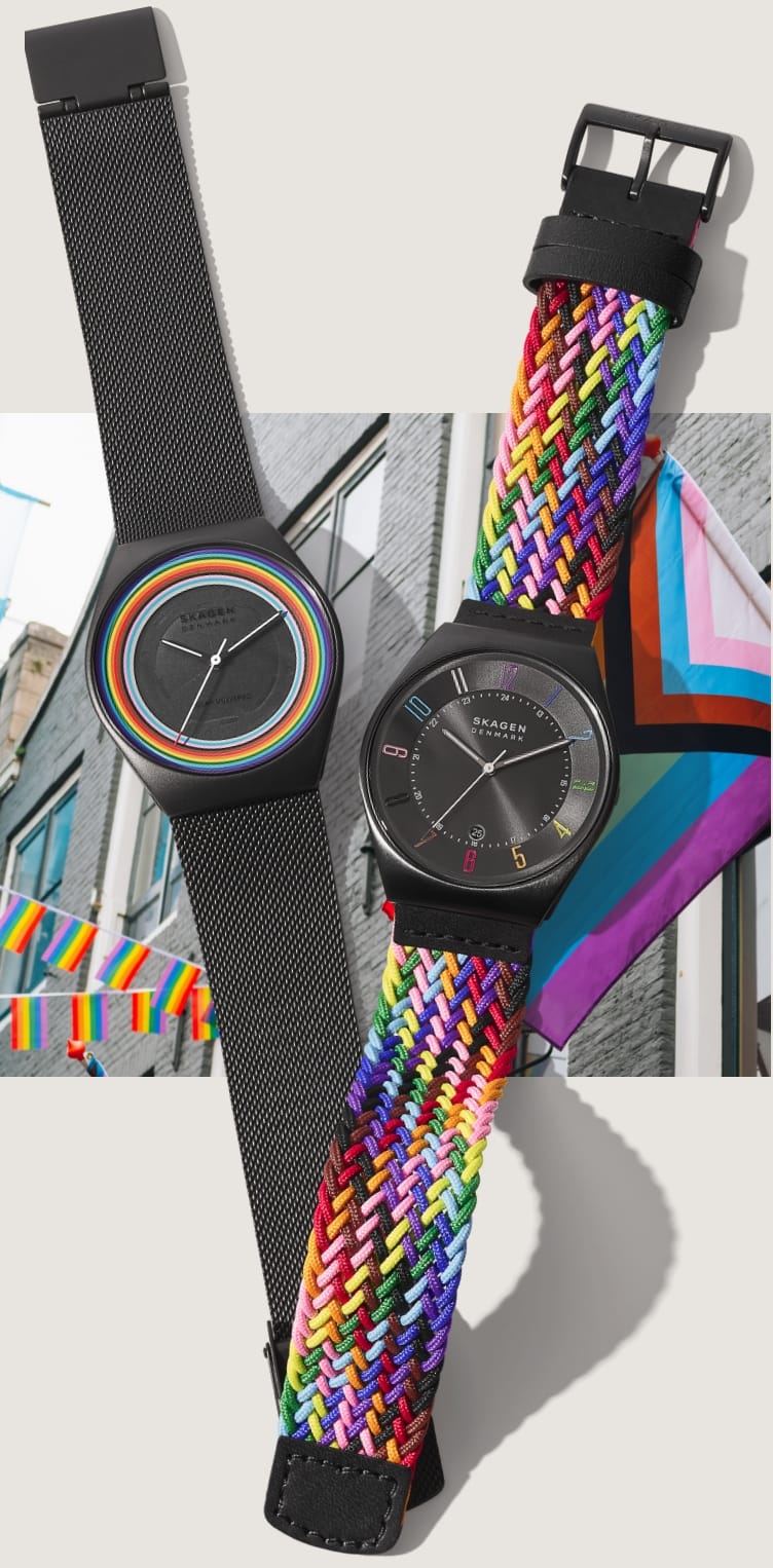 Image of two Pride Month watches set on a city street full of Pride flags