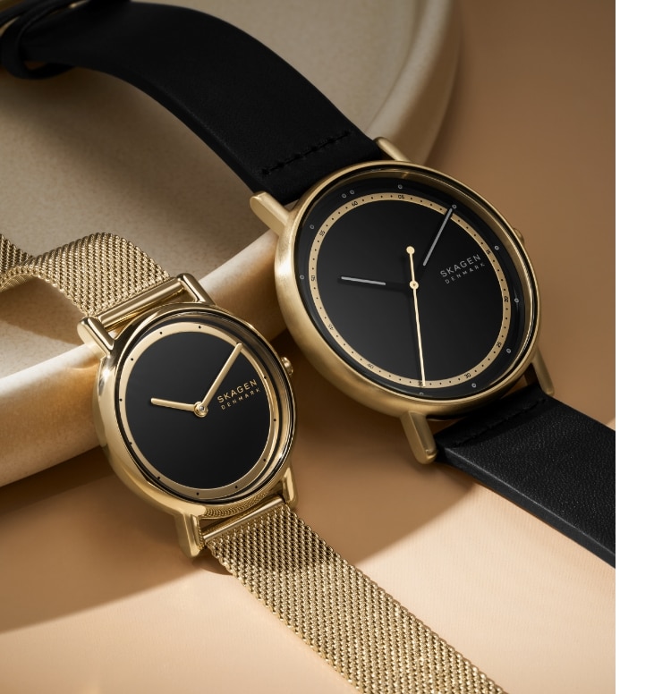 Image of smaller and larger black and gold Signature watches
