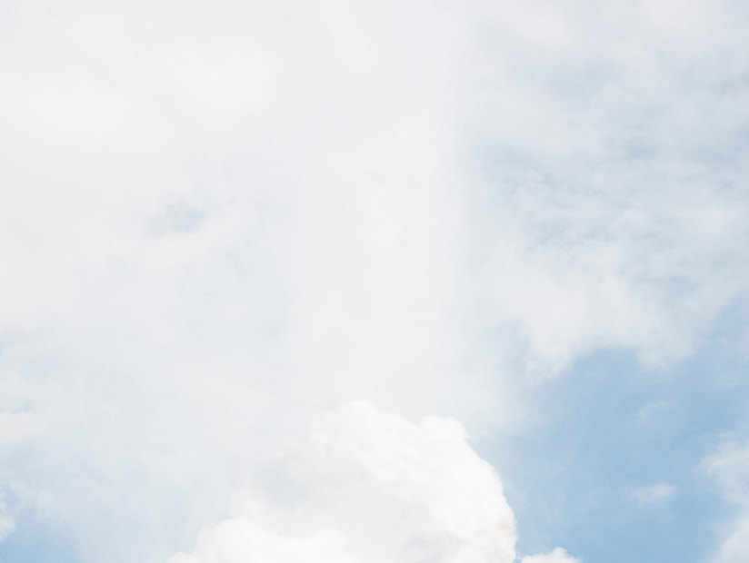 blue decorative background with fluffy white clouds