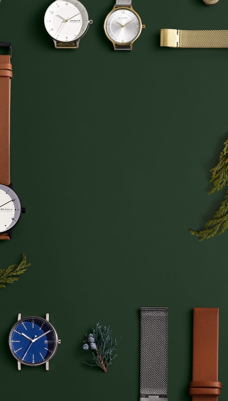 Various Skagen products on a green background.