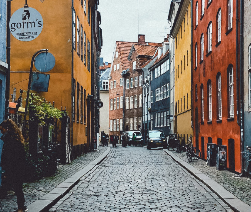 a collection of row houses and a cobblestone street