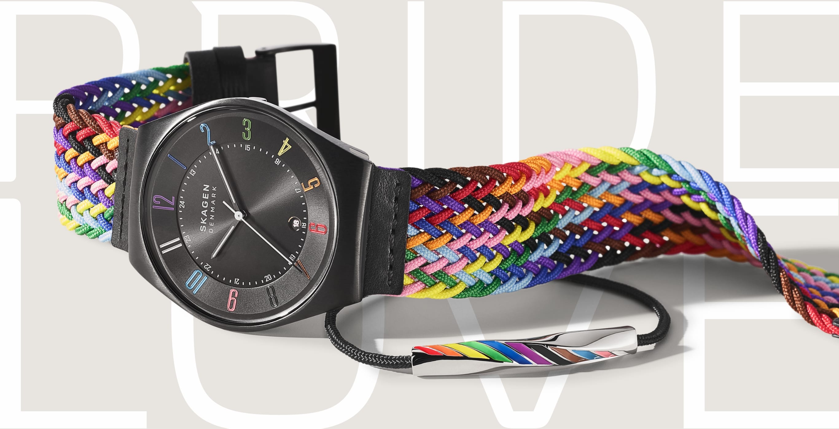 Bild einer Pride Uhr und eines Pride Armbands