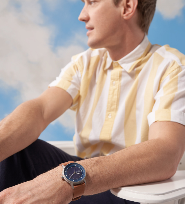 a man wearing a solar watch