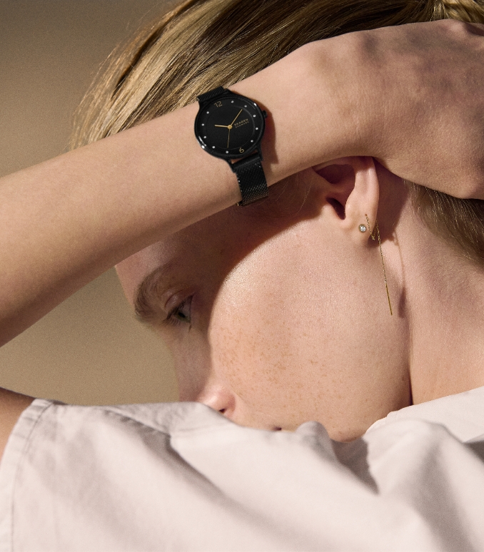 Female model with black watch.