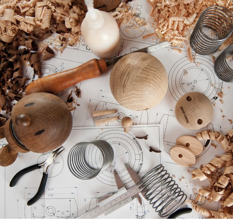Image of Hoptimist figurines on a workbench.