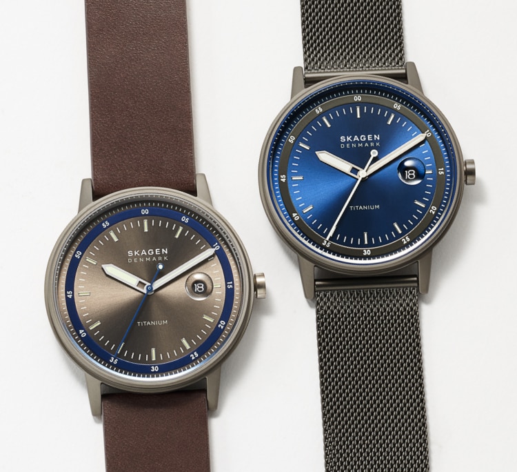 a pair of henricksen titanium watches