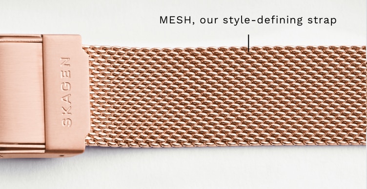 A close-up of a rose gold mesh strap. Callout: MESH, our style-defining strap