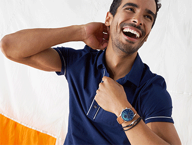 Silver case, blue dial, brown leather strap. Black bracelets with silver accents.