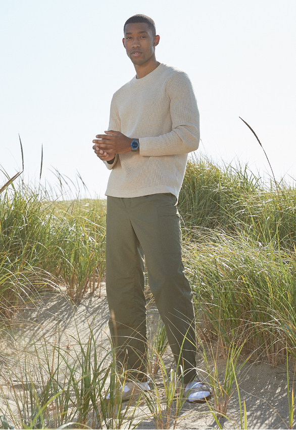 Image of a man standing in a field.