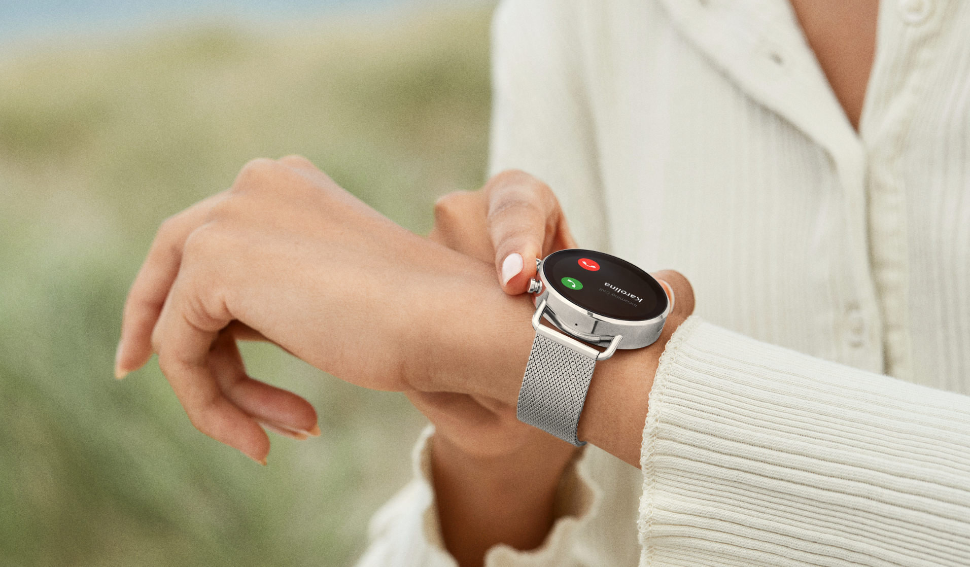 Image of woman answering her phone on her watch.