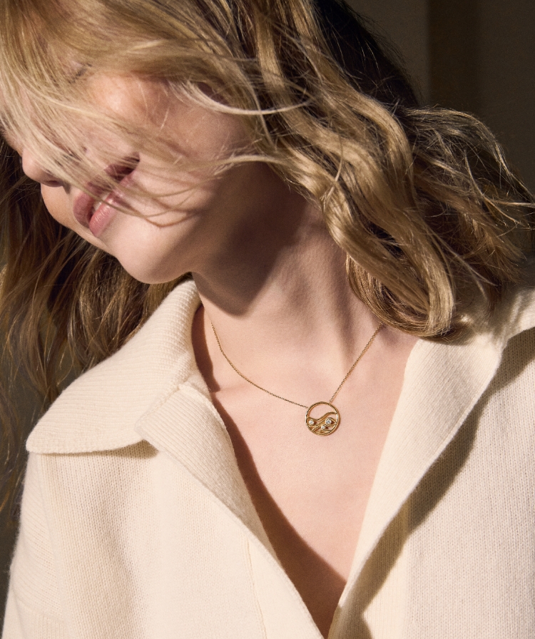 Image of a model wearing this jewelry collection